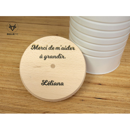wooden lid engraved with a message