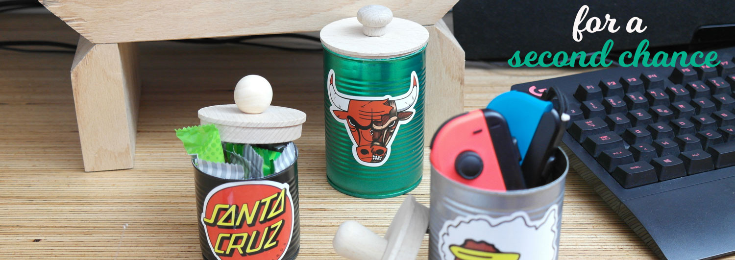 Recycled painted tin cans with wooden lids
